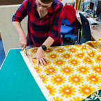 Sarah Waterhouse, silkscreen textile printer at work in her studio 2019